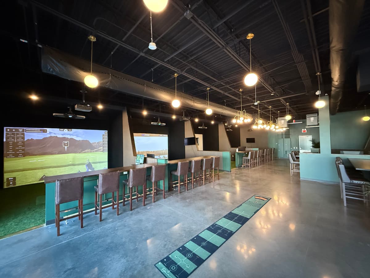 The Clubhouse bar seating and simulator bays in Wesley Chapel